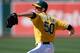 OAKLAND, CA - JUNE 02: Grant Balfour #50 of the Oakland Athletics pitches in the ninth inning against the Chicago White Sox at O.co Coliseum on June 2, 2013 in Oakland, California. The Athletics defeated the White Sox 2-0. (Photo by Thearon W. Henderson/Getty Images)