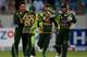 DUBAI, UNITED ARAB EMIRATES - DECEMBER 20: Players of Pakistan celebrate the wicket of Kusal Janith Perera of Sri Lanka during the second One-Day International (ODI ) match between Sri Lanka and Pakistan at the Dubai Sports City Cricket Stadium on December 20, 2013 in Dubai, United Arab Emirates. (Photo by Francois Nel/Getty Images)