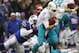 Dec 22, 2013; Orchard Park, NY, USA; Buffalo Bills strong safety Da'Norris Searcy (25) sacks Miami Dolphins quarterback Ryan Tannehill (17) during the first half at Ralph Wilson Stadium. Mandatory Credit: Kevin Hoffman-USA TODAY Sports