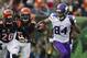 Dec 22, 2013; Cincinnati, OH, USA; Minnesota Vikings wide receiver Cordarrelle Patterson (84) runs the ball past Cincinnati Bengals free safety Reggie Nelson (20) and linebacker Jayson DiManche (51) in the third quarter of the game at Paul Brown Stadium. Cincinnati Bengals beat the Minnesota Vikings by the score of 42-14. Mandatory Credit: Trevor Ruszkowksi-USA TODAY Sports