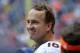 HOUSTON, TX - DECEMBER 22: Peyton Manning #18 of the Denver Broncos acknowledges the crowd after throwing a record 51 touchdowns in a season during a game against the Houston Texans at Reliant Stadium on December 22, 2013 in Houston, Texas. (Photo by Bob Levey/Getty Images)