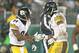 GREEN BAY, WI - DECEMBER 22: Le'Veon Bell #26 of the Pittsburgh Steelers celebrates his game-winning touchdown with teammate Antonio Brown #84 against the Green Bay Packers at Lambeau Field on December 22, 2013 in Green Bay, Wisconsin. The Steelers defeated the Packers 38-31. (Photo by Jonathan Daniel/Getty Images)