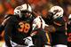 STILLWATER, OK - NOVEMBER 23: Emmanuel Ogbah #38 of the Oklahoma State Cowboys celebrates with teammates in the second quarter against the Baylor Bears at Boone Pickens Stadium on November 23, 2013 in Stillwater, Oklahoma. (Photo by Ronald Martinez/Getty Images)