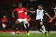MANCHESTER, ENGLAND - OCTOBER 29: Wilfried Zaha of Manchester United is challenged by Bradley Johnson of Norwich City during the Capital One Cup fourth round match between Manchester United and Norwich City at Old Trafford on October 29, 2013 in Manchester, England. (Photo by Clive Brunskill/Getty Images)