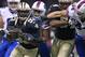Oct 27, 2013; New Orleans, LA, USA; New Orleans Saints outside linebacker Junior Galette (93) is tackled by Buffalo Bills running back Fred Jackson (behind) after recovering a fumble as New Orleans Saints wide receiver Kenny Stills (84) fights off Buffalo Bills tight end Scott Chandler (84) in the first quarter at Mercedes-Benz Superdome. Mandatory Credit: Crystal LoGiudice-USA TODAY Sports
