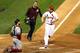 Matt Holliday crosses home plate in Game 5 of the World Series against Boston.
