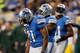 DETROIT, MI - NOVEMBER 28: Reggie Bush #21 of the Detroit Lions looks at the ground after a first quarter fumble while playing the Green Bay Packers at Ford Field on November 28, 2013 in Detroit, Michigan. (Photo by Gregory Shamus/Getty Images)