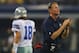 ARLINGTON, TX - AUGUST 24: Head coach Jason Garrett of the Dallas Cowboys on the field as Kyle Orton #18 walks past during a preseason game at AT&T Stadium on August 24, 2013 in Arlington, Texas. (Photo by Ronald Martinez/Getty Images)