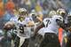 CHARLOTTE, NC - DECEMBER 22: Drew Brees #9 of the New Orleans Saints drops back to pass against the Carolina Panthers during their game at Bank of America Stadium on December 22, 2013 in Charlotte, North Carolina. (Photo by Streeter Lecka/Getty Images)