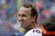 HOUSTON, TX - DECEMBER 22: Peyton Manning #18 of the Denver Broncos acknowledges the crowd after throwing a record 51 touchdowns in a season during a game against the Houston Texans at Reliant Stadium on December 22, 2013 in Houston, Texas. (Photo by Bob Levey/Getty Images)