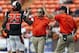 Dec 24, 2013; Honolulu, HI, USA; Oregon State Beavers safety Ryan Murphy (25) gets a high five from defensive coordinator Mike Banker (middle) and head coach Mike Riley during the 2nd quarter of the 2013 Hawaii Bowl against the Boise State Broncos at Aloha Stadium. Mandatory Credit: Marco Garcia-USA TODAY Sports