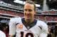 HOUSTON, TX - DECEMBER 22: Peyton Manning #18 of the Denver Broncos celebrates as he walks off the field after setting the NFL record for touchdown passes in a season with 51 in a 37-13 defeat of the Houston Texans at Reliant Stadium on December 22, 2013 in Houston, Texas. (Photo by Scott Halleran/Getty Images)