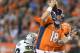 Sep 23, 2013; Denver, CO, USA; Oakland Raiders defensive end Lamarr Houston (99) sacks Denver Broncos quarterback Peyton Manning (18) at Sports Authority Field at Mile High. The Broncos defeated the Raiders 37-21. Mandatory Credit: Kirby Lee-USA TODAY Sports