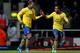 LONDON, ENGLAND - DECEMBER 26: Lukas Podolski of Arsenal (L) celebrates with Theo Walcott as he scores their third goal during the Barclays Premier League match between West Ham United and Arsenal at Boleyn Ground on December 26, 2013 in London, England. (Photo by Ian Walton/Getty Images)