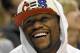 Nov 29, 2013; Indianapolis, IN, USA; Professional Boxer Floyd Mayweather Jr. laughs during a timeout during the second half of the game at Bankers Life Fieldhouse. Indiana Pacers win 93 to 73. Mandatory Credit: Marc Lebryk-USA TODAY Sports