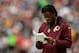 LANDOVER, MD - DECEMBER 22: Quarterback Robert Griffin III #10 of the Washington Redskins watches play from the sideline in the second quarter during an NFL game against the Dallas Cowboys at FedExField on December 22, 2013 in Landover, Maryland. (Photo by Patrick McDermott/Getty Images)