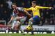 LONDON, ENGLAND - DECEMBER 26: Aaron Ramsey of Arsenal holds off Kevin Nolan of West Ham United during the Barclays Premier League match between West Ham United and Arsenal at Boleyn Ground on December 26, 2013 in London, England. (Photo by Ian Walton/Getty Images)
