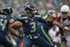 SEATTLE, WA - DECEMBER 22: Quarterback Russell Wilson #3 of the Seattle Seahawks passes against the Arizona Cardinals at CenturyLink Field on December 22, 2013 in Seattle, Washington. (Photo by Otto Greule Jr/Getty Images)