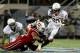 Dec 28, 2013; Orlando, FL, USA; Miami Hurricanes running back Dallas Crawford (25) is brought down during the second quarter of the Russell Athletic Bowl at Florida Citrus Bowl Stadium. Mandatory Credit: Rob Foldy-USA TODAY Sports