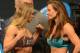 Dec 27, 2013; Las Vegas, NV, USA; Ronda Rousey and Misha Tate face off after the weigh-in for their UFC Women's Bantamweight Title Fight at MGM Grand Garden Arena. Mandatory Credit: Jayne Kamin-Oncea-USA TODAY Sports