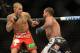Dec 28, 2013; Las Vegas, NV, USA; Dustin Poirier (red gloves) and Diego Brandao (blue gloves) fight during their UFC middleweight bout at the MGM Grand Garden Arena. Dustin Poirier won Mandatory Credit: Jayne Kamin-Oncea-USA TODAY Sports