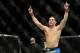 Dec 28, 2013; Las Vegas, NV, USA; Chris Weidman reacts in the cage after defeating Anderson Silva (not pictured) in their UFC middleweight championship bout at the MGM Grand Garden Arena. Mandatory Credit: Jayne Kamin-Oncea-USA TODAY Sports