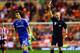 SUNDERLAND, ENGLAND - DECEMBER 17: Referee Anthony Taylor shows David Luiz of Chelsea a yellow card during the Capital One Cup Quarter-Final match between Sunderland and Chelsea at Stadium of Light on December 17, 2013 in Sunderland, England. (Photo by Matthew Lewis/Getty Images)