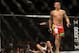 Dec 28, 2013; Las Vegas, NV, USA; Dustin Poirier (red gloves) reacts after knocking down Diego Brandao (blue gloves) during their UFC middleweight bout at the MGM Grand Garden Arena. Mandatory Credit: Jayne Kamin-Oncea-USA TODAY Sports