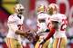 GLENDALE, AZ - DECEMBER 29: Carlos Rogers #22 of the San Francisco 49ers celebrates with teammates Tramaine Brock #26 and Tarell Brown #25 after a turnover on downs in the third quarter against the Arizona Cardinals during a game at University of Phoenix Stadium on December 29, 2013 in Glendale, Arizona. (Photo by Christian Petersen/Getty Images)