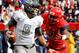Nov 23, 2013; Tucson, AZ, USA; Oregon Ducks quarterback Marcus Mariota (8) runs the ball under pressure from Arizona Wildcats linebacker Marquis Flowers (2) during the first quarter at Arizona Stadium. Arizona beat Oregon 42-16. Mandatory Credit: Casey Sapio-USA TODAY Sports