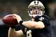 NEW ORLEANS, LA - DECEMBER 29: Drew Brees #9 of the New Orleans Saints warms up before his team takes on the Tampa Bay Buccaneers at Mercedes-Benz Superdome on December 29, 2013 in New Orleans, Louisiana. (Photo by Sean Gardner/Getty Images)