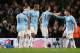 MANCHESTER, ENGLAND - DECEMBER 28: Edin Dzeko of Manchester City is congratulated by his team-mates after scoring the opening goal during the Barclays Premier League match between Manchester City and Crystal Palace at the Etihad Stadium on December 28, 2013 in Manchester, England. (Photo by Jan Kruger/Getty Images)