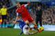LIVERPOOL, ENGLAND - DECEMBER 29: Luke Shaw of Southampton is tackled by Steven Naismith of Everton during the Barclays Premier League match between Everton and Southampton at Goodison Park on December 29, 2013 in Liverpool, England. (Photo by Paul Thomas/Getty Images)