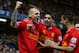 LONDON, ENGLAND - DECEMBER 29: Martin Skrtel of Liverpool celebrates with teammates Luis Suarez (M) and Philippe Coutinho (R) after scoring the opening goal during the Barclays Premier League match between Chelsea and Liverpool at Stamford Bridge on December 29, 2013 in London, England. (Photo by Clive Rose/Getty Images)