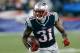 FOXBORO, MA - SEPTEMBER 12: Aqib Talib #31 of the New England Patriots runs the ball after he intercepted a pass intended for a New York Jets receiver in the 4th quarter at Gillette Stadium on September 12, 2013 in Foxboro, Massachusetts. (Photo by Jim Rogash/Getty Images)