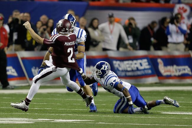 Hi-res-459838559-safety-devon-edwards-of-the-duke-blue-devils-grabs-the_crop_north