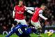LONDON, ENGLAND - JANUARY 01: Jack Wilshere of Arsenal (R) evades Gary Medel of Cardiff City as Lukas Podolski of Arsenal looks on during the Barclays Premier League match between Arsenal and Cardiff City at Emirates Stadium on January 1, 2014 in London, England. (Photo by Shaun Botterill/Getty Images)
