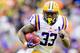 BATON ROUGE, LA - NOVEMBER 23: Running back Jeremy Hill #33 of the LSU Tigers runs the ball against the Texas A&M Aggies at Tiger Stadium on November 23, 2013 in Baton Rouge, Louisiana. (Photo by Sean Gardner/Getty Images)