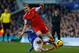 LIVERPOOL, ENGLAND - DECEMBER 29: Luke Shaw of Southampton is tackled by Steven Naismith of Everton during the Barclays Premier League match between Everton and Southampton at Goodison Park on December 29, 2013 in Liverpool, England. (Photo by Paul Thomas/Getty Images)