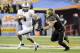 Jan 1, 2014; Glendale, AZ, USA; UCF Knights quarterback Blake Bortles (5) runs the ball under pressure from Baylor Bears linebacker Eddie Lackey (5) during the first quarter at University of Phoenix Stadium during the Fiesta Bowl. Mandatory Credit: Casey Sapio-USA TODAY Sports