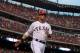 ARLINGTON, TX - APRIL 07: Michael Young #10 of the Texas Rangers celebrates a run against the Chicago White Sox at Rangers Ballpark in Arlington on April 7, 2012 in Arlington, Texas. (Photo by Ronald Martinez/Getty Images)