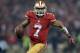 Dec 23, 2013; San Francisco, CA, USA; San Francisco 49ers quarterback Colin Kaepernick (7) scrambles in the fourth quarter against the Atlanta Falcons in the final regular season game at Candlestick Park. Mandatory Credit: Kirby Lee-USA TODAY Sports