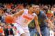 Dec 31, 2013; Syracuse, NY, USA; Syracuse Orange guard Tyler Ennis (11) drives to the basket around Eastern Michigan Eagles guard J.R. Sims (2) during the second half at the Carrier Dome. Syracuse defeated Eastern Michigan 70-48. Mandatory Credit: Rich Barnes-USA TODAY Sports