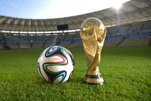 Hi-res-453347919-general-view-of-brazuca-and-the-fifa-world-cup-trophy_crop_north
