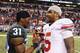 Dec 7, 2013; Indianapolis, IN, USA; Michigan State Spartans cornerback Darqueze Dennard (31) shakes with Ohio State Buckeyes quarterback Braxton Miller (5) after the Big 10 Championship game at Lucas Oil Stadium. Michigan State defeats Ohio State 34-24. Mandatory Credit: Brian Spurlock-USA TODAY Sports