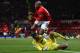 MANCHESTER, ENGLAND - JANUARY 01: Hugo Lloris of Tottenham Hotspur collides with Ashley Young of Manchester United during the Barclays Premier League match between Manchester United and Tottenham Hotspur at Old Trafford on January 1, 2014 in Manchester, England. (Photo by Michael Regan/Getty Images)