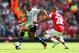 LONDON, ENGLAND - SEPTEMBER 01: Kieran Gibbs of Arsenal marshalls Andros Townsend of Spurs during the Barclays Premier League match between Arsenal and Tottenham Hotspur at Emirates Stadium on September 01, 2013 in London, England. (Photo by Clive Mason/Getty Images)