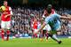 MANCHESTER, ENGLAND - DECEMBER 14: Sergio Aguero of Manchester City scores the opening goal during the Barclays Premier League match between Manchester City and Arsenal at Etihad Stadium on December 14, 2013 in Manchester, England. (Photo by Clive Brunskill/Getty Images)