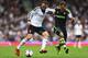 LONDON, ENGLAND - OCTOBER 05: Dimitar Berbatov of Fulham takes on Erik Pieters of Stoke City during the Barclays Premier League match between Fulham and Stoke City at Craven Cottage on October 5, 2013 in London, England. (Photo by Paul Gilham/Getty Images)