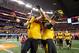 ARLINGTON, TX - JANUARY 03: Evan Boehm #77 and Lucas Vincent #96 of the Missouri Tigers celebrates the Tigers 41-31 victory against the Oklahoma State Cowboys during the AT&T Cotton Bowl on January 3, 2014 in Arlington, Texas. (Photo by Ronald Martinez/Getty Images)